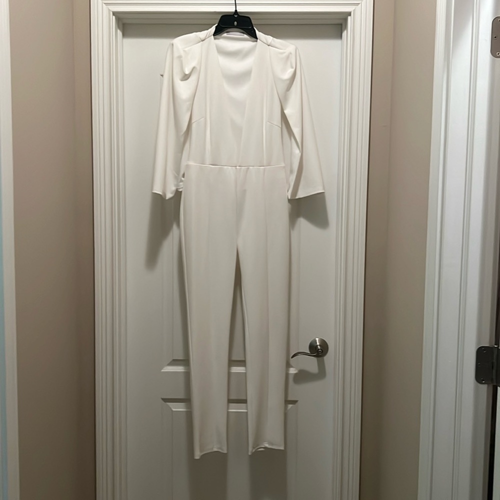 100% knit very low cut jumpsuit with cape